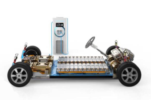 Technician performing an EV battery health check using diagnostic tools